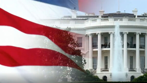 The White House stands prominently, adorned with the American flag waving in the foreground.