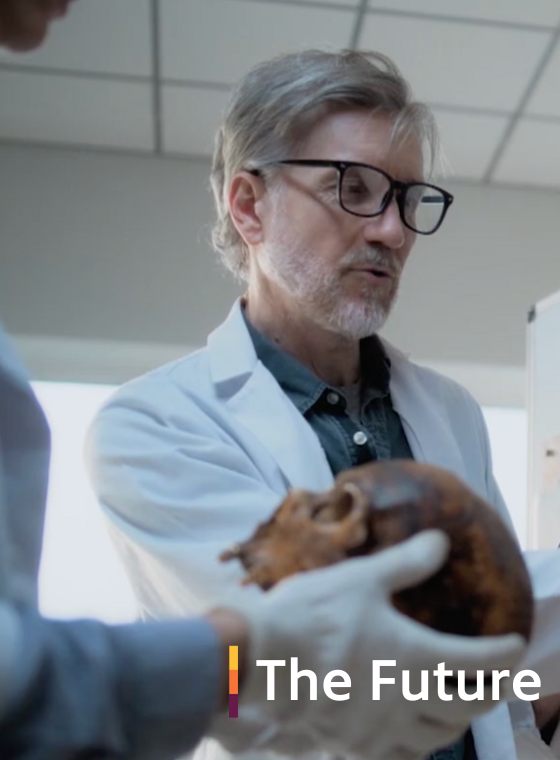 Scientists pointing at a drawing of Lucy, the first human fossil