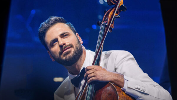 Hauser plays the cello on stage