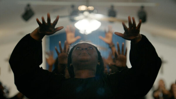 A woman worshipping at church