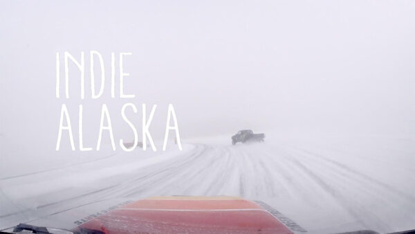 A person racing a vehicle in the snow