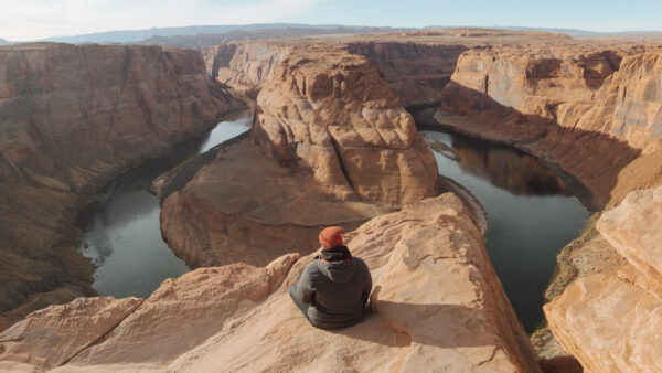 Trail Mix'd host Jayarr Steiner sitting on a trail