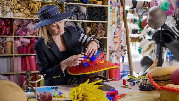 A woman working on a hat for the kentucky derby