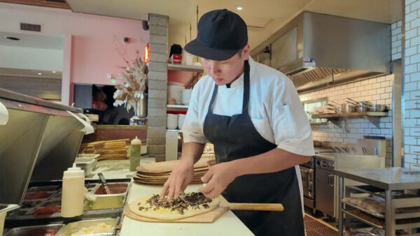 A chef prepares a pizza at The Parlor