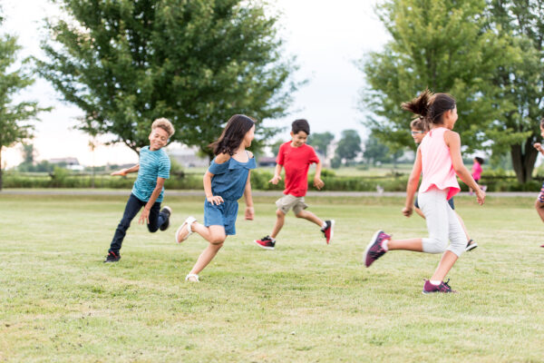 Kids run around outside