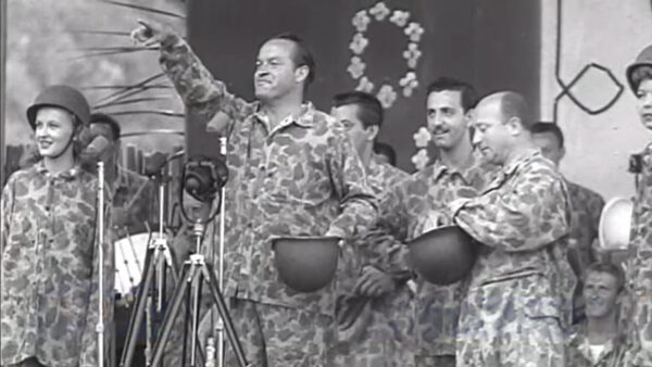 Bob Hope on stage entertaining the troops
