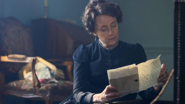A woman reading a letter