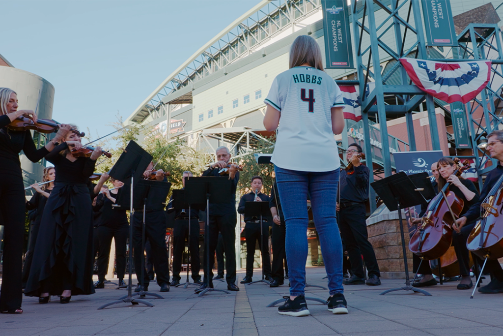 The Phoenix Symphony performs outside the Arizona Diamondbacks stadium with Governor Katie Hobbs in attendance