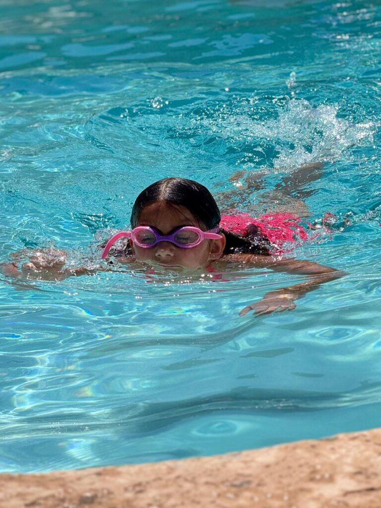 A girl swimming in the pool
