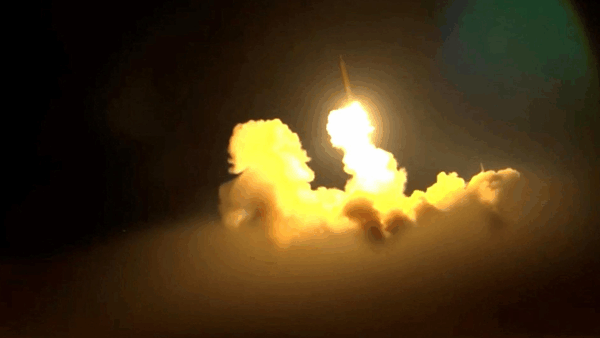A bright bomb going off at night