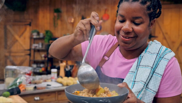 A contestant on the Great American Recipe pouring her dish into a bowl