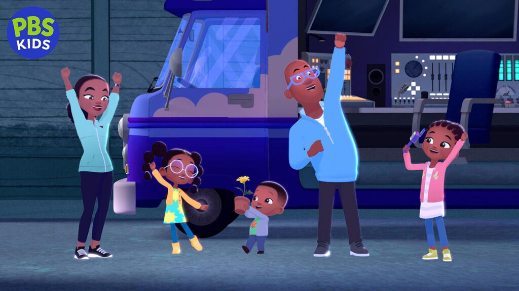 A family stands together in front of a bus, smiling and posing for the photo