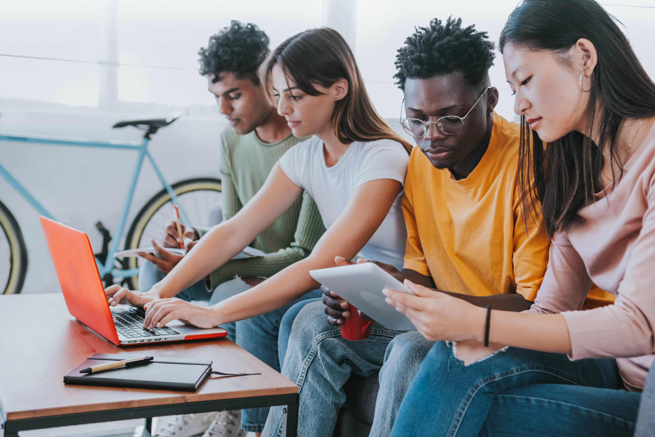 A group of people working on a computer
