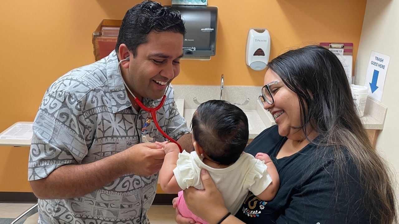Dr. Saisho Mangla, a Banner Health pediatrician in Chandler, greets a young patient.