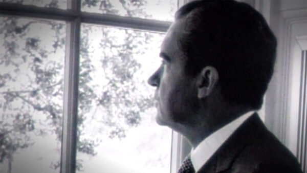 Former President Richard Nixon looking out a window