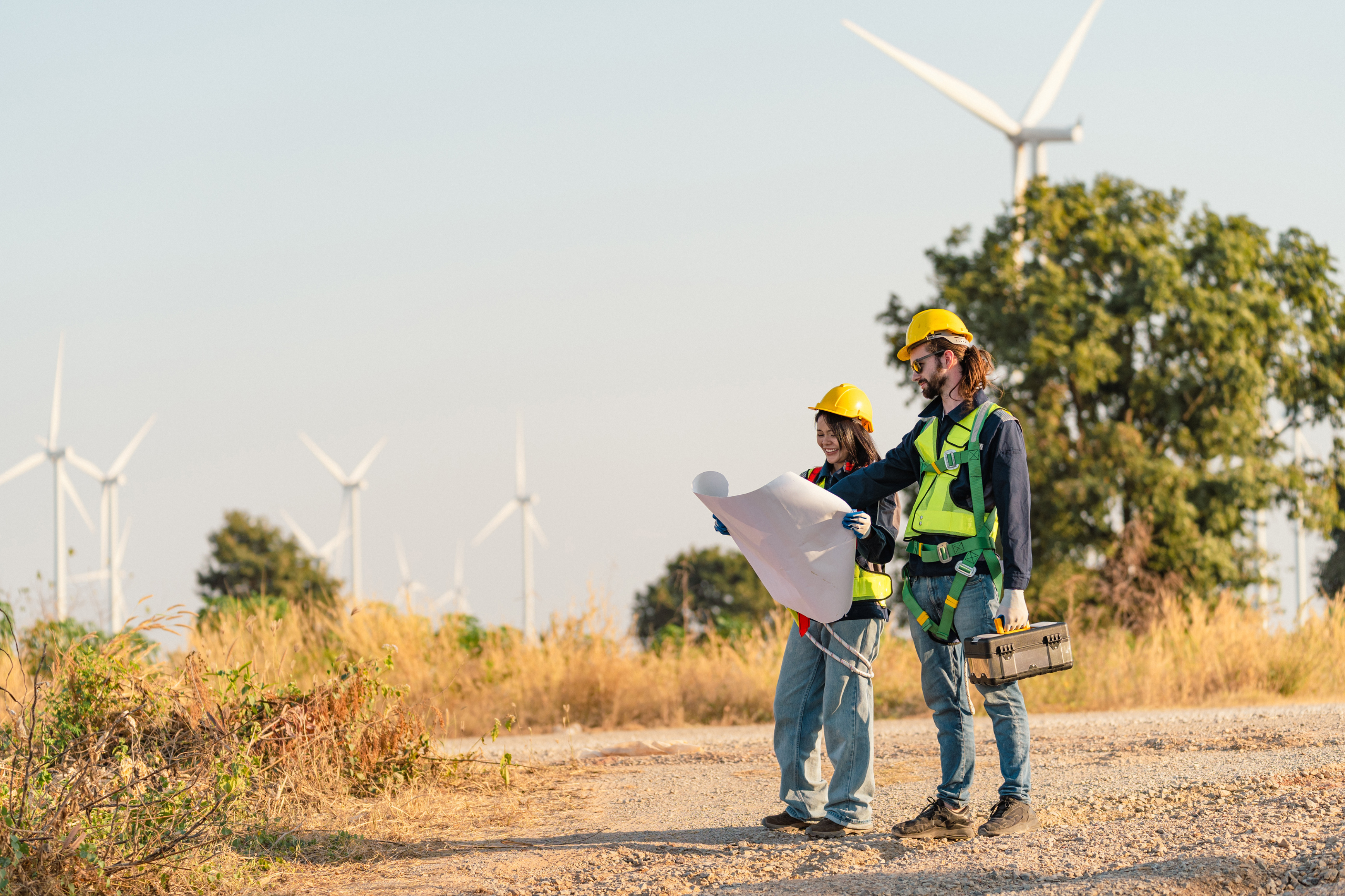 Two people looking at a blueprint