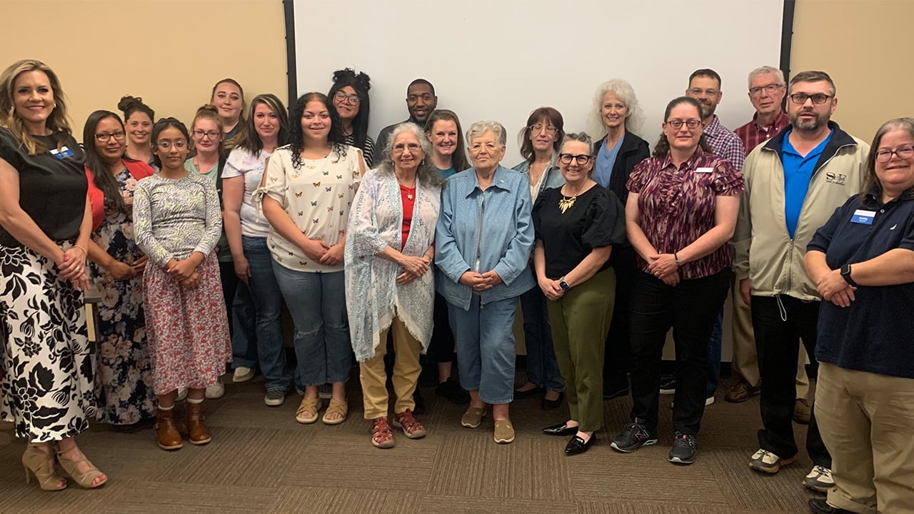 A diverse group of people standing together.
