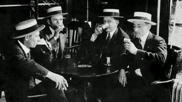 A group of men sitting around drinking