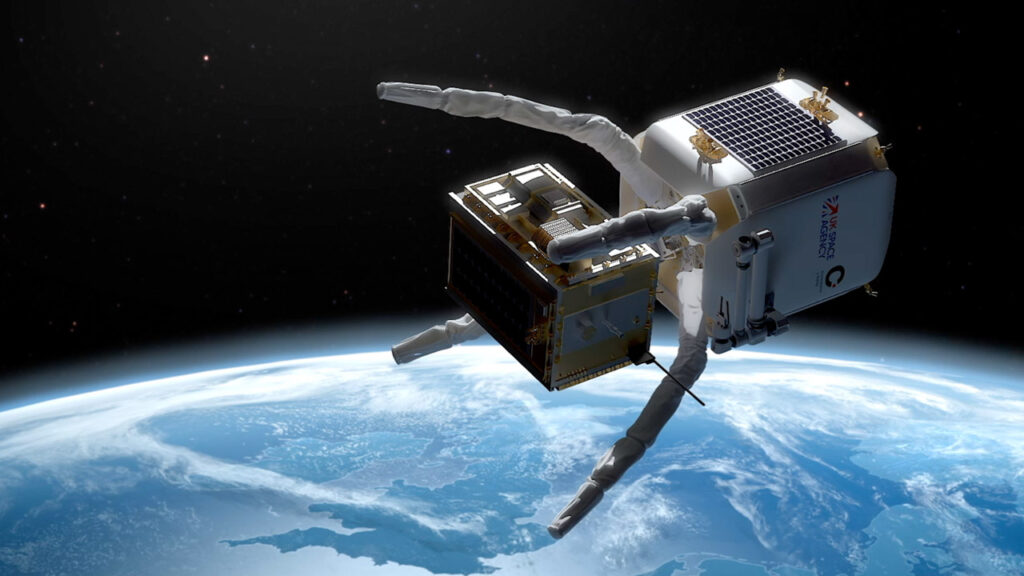 An orbiter in space grabs a piece of cargo