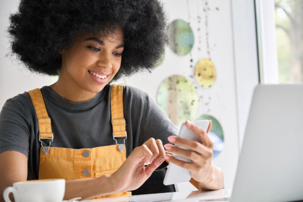 A girl smiling on her phone