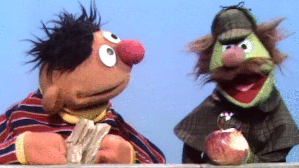 A detective looking into Ernie's apple