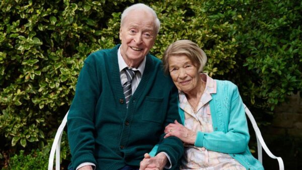 Characters Bernie and Irene smiling together on a bench