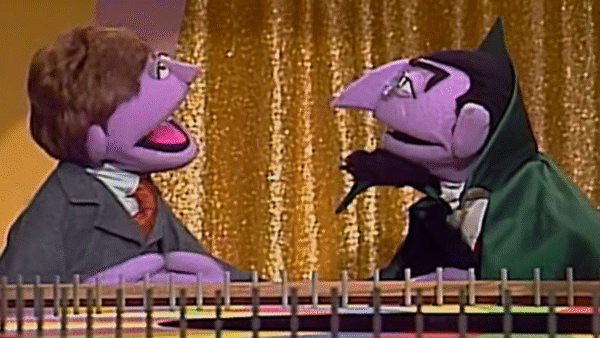 The characters from Sesame street playing squeal of fortune