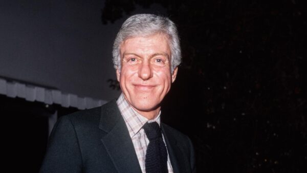 Dick Van Dyke in a black suit and tie
