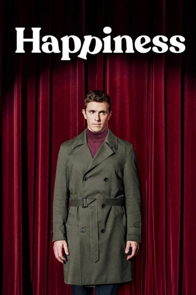 Graphic reading Happiness, featuring a man standing in front of a red curtain
