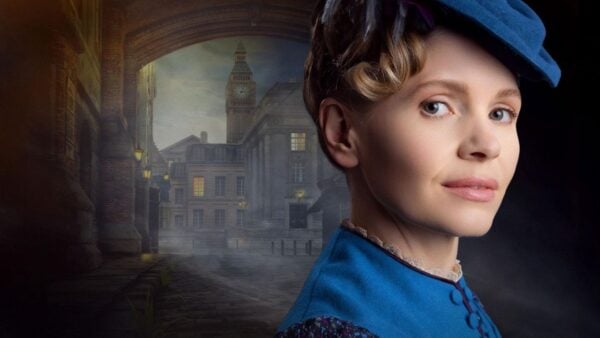 Miss Scarlet in a blue blouse and blue hat