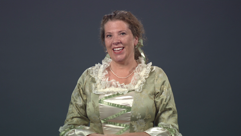 A member of Daughters of the Revolution in period dress