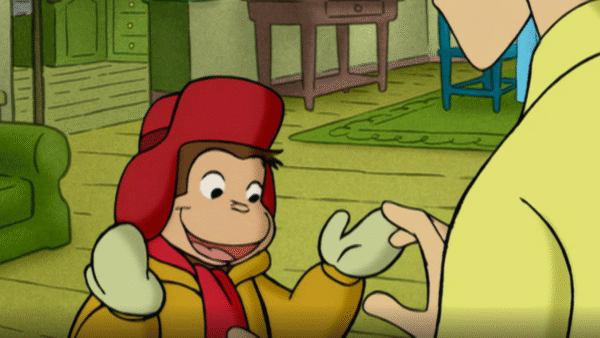 Curious George wearing winter clothes