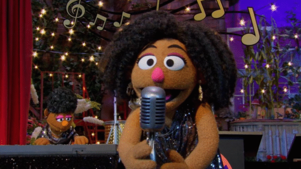 Characters from Sesame Street singing