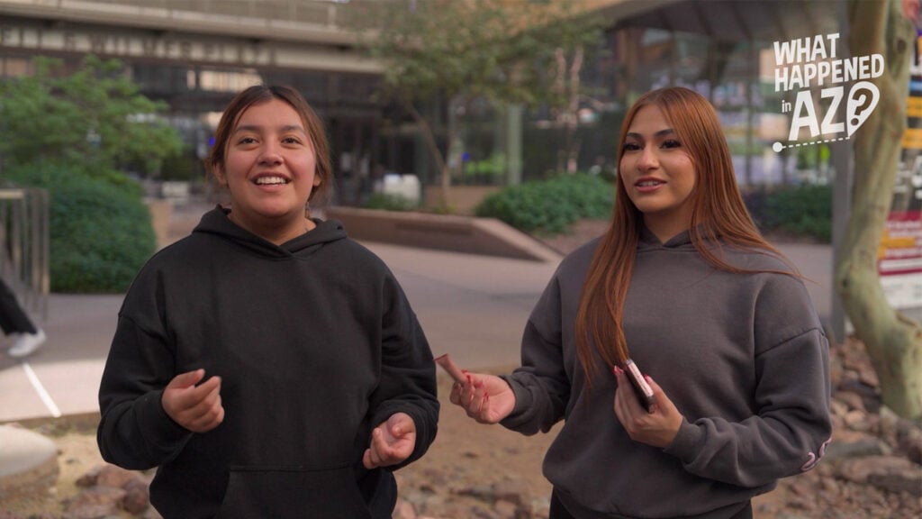 Two students stand outside a school building at ASU