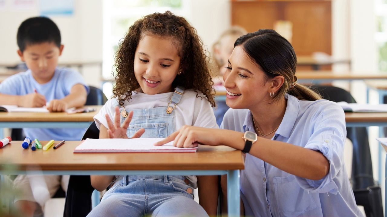 A teacher helping a student