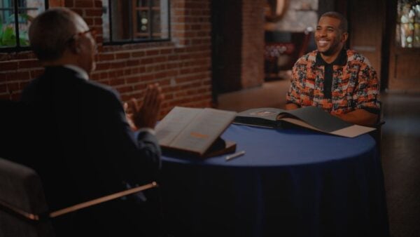 Chris Paul sitting across from Dr. Gates