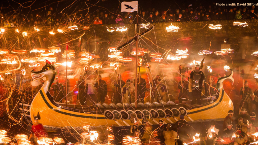 A boat on the water with lights glowing around it