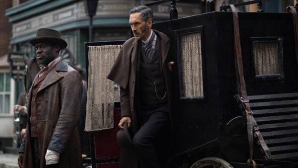 Moses and Clarence exit a carriage