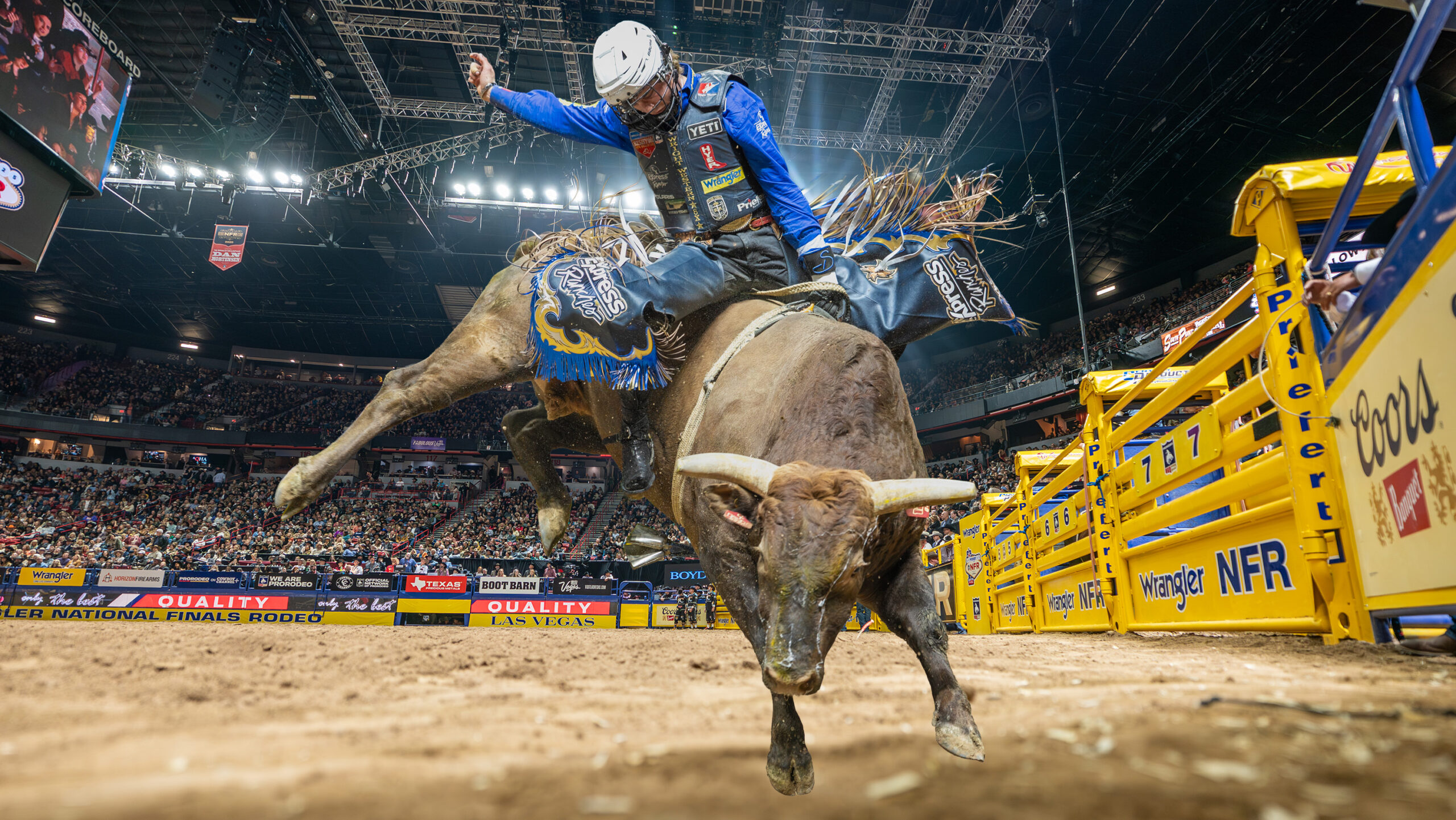 A man riding a bull at a rodeo