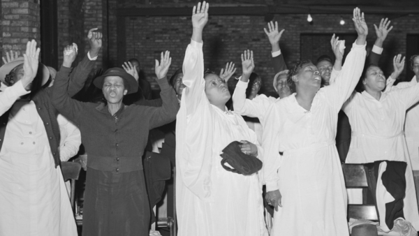 A group of people singing at church