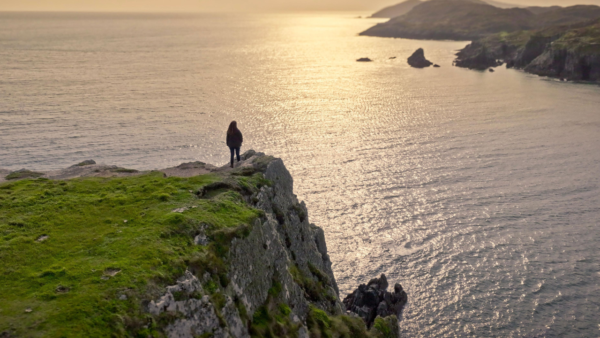 A lady looking out to the water