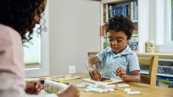 A little kid playing math games