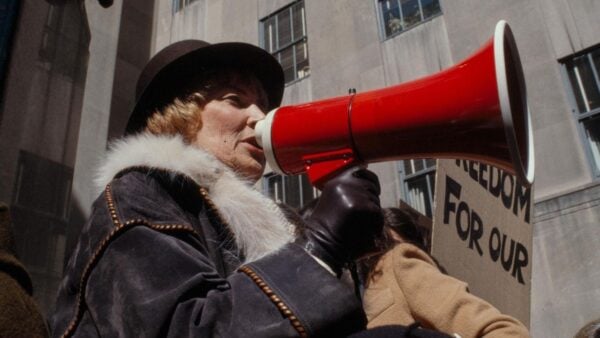 Bella Abzug speaking through a megaphone