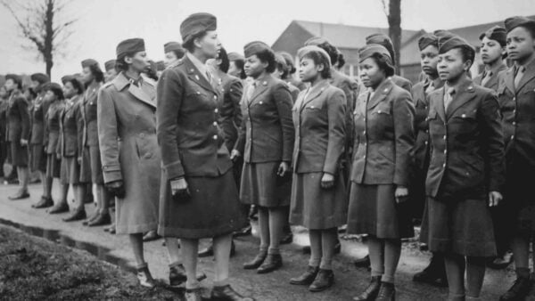 An old photo of women standing in a line