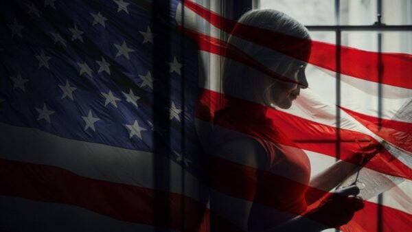 Lucy Worsley with an image of the American flag overlaid on top