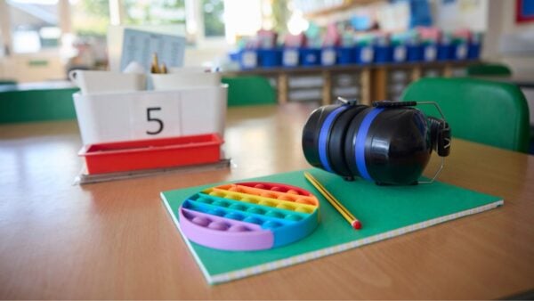 A fidget toy and a pair of headphones
