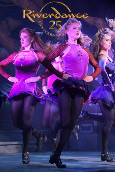 A poster with women dancing on stage and text reading "Riverdance 25"