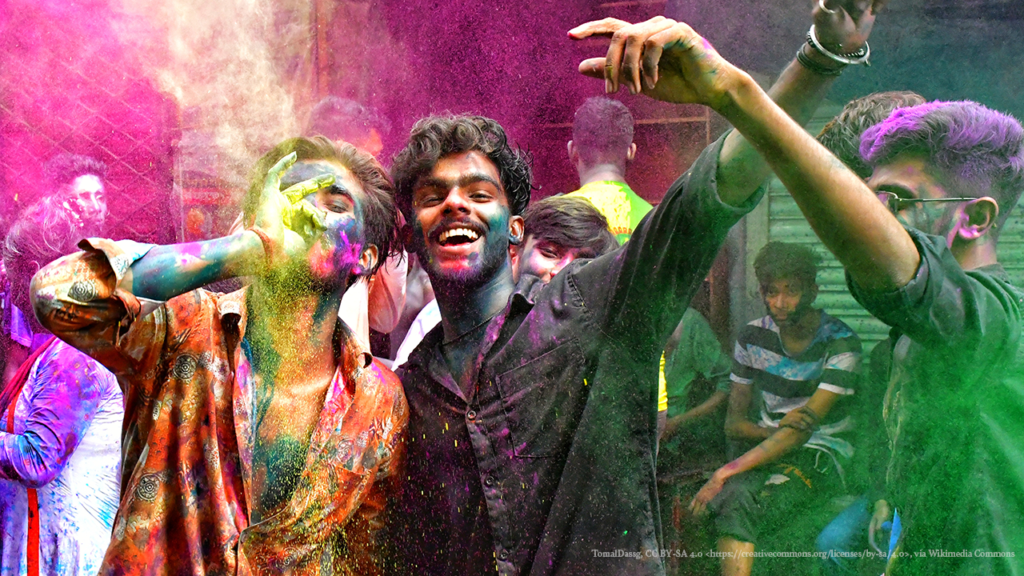 A group of people covered in colorful powder