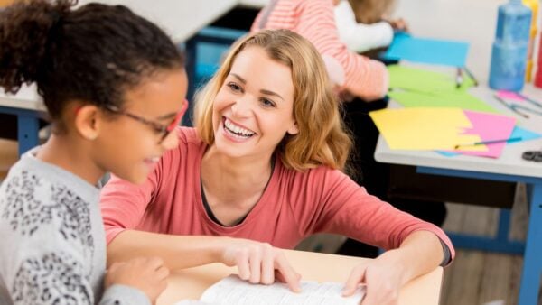 A teacher helping a student