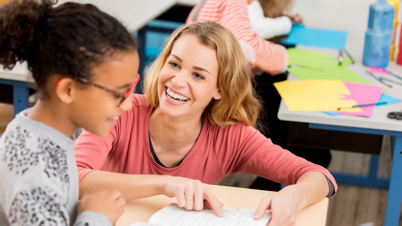 A teacher helping a student